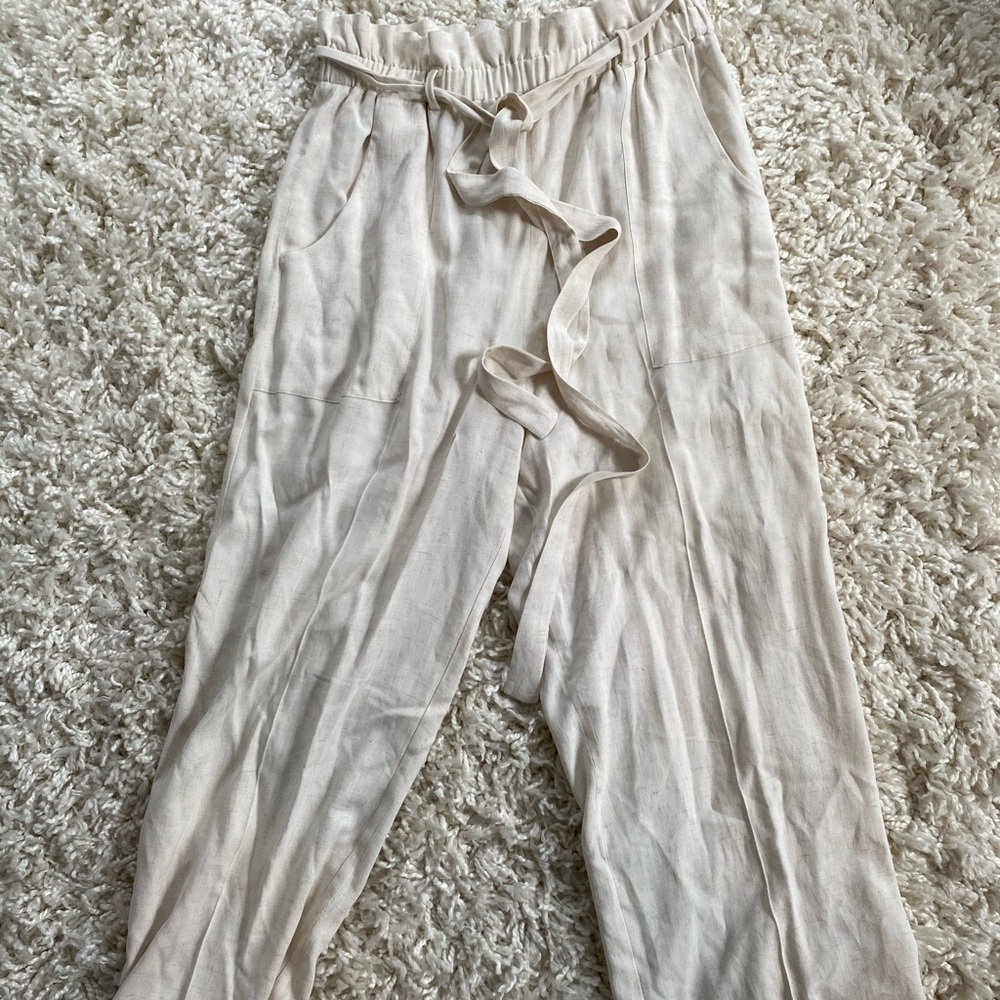 Oatmeal colored pants. Paper bag pants